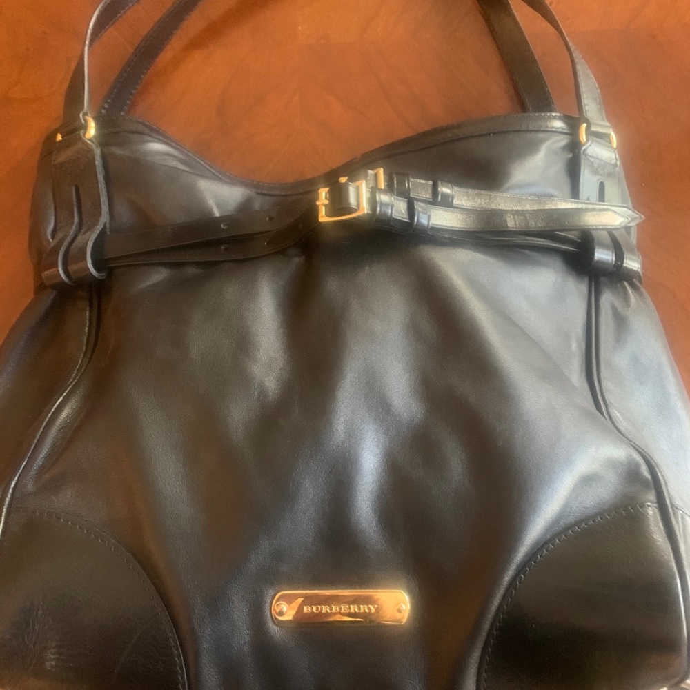 Burberry black calf skin purse.